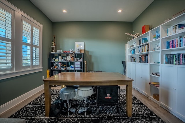 office space with hardwood / wood-style flooring