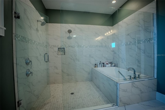 bathroom with separate shower and tub