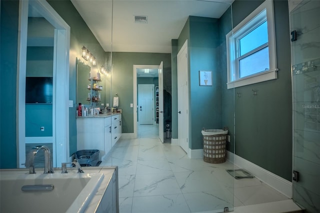 bathroom with a bathing tub and vanity