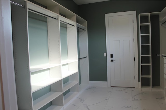 2437 Bay Lake Loop, Groveland, FL 34736 - mudroom featuring baseboards and marble finish floor