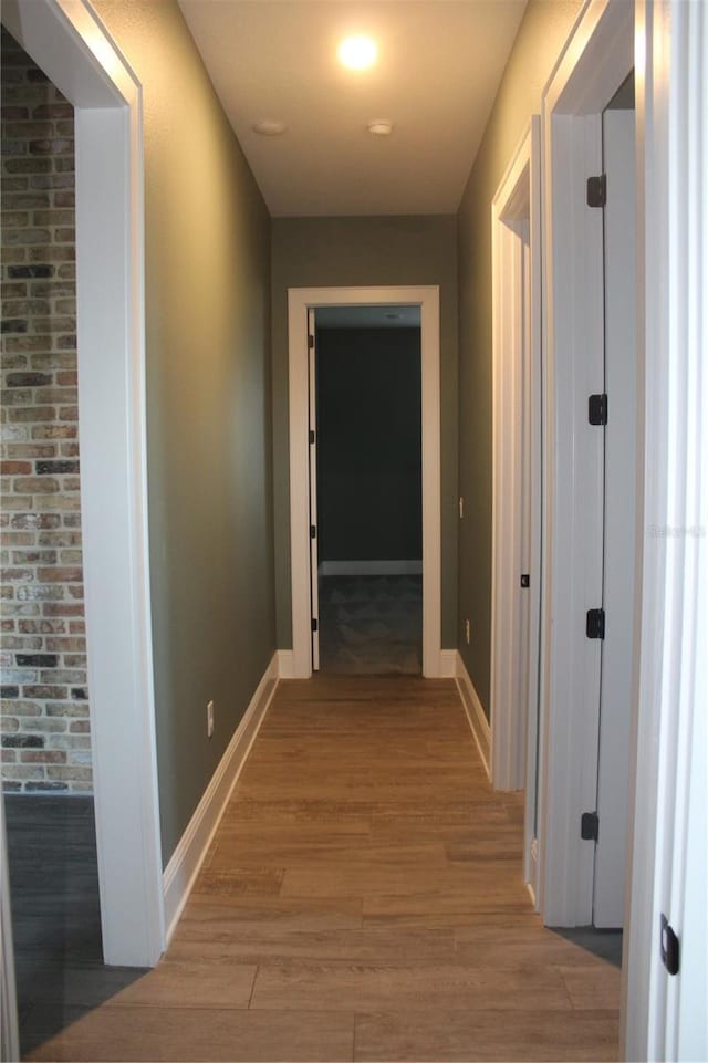 2437 Bay Lake Loop, Groveland, FL 34736 - corridor featuring baseboards and light wood finished floors