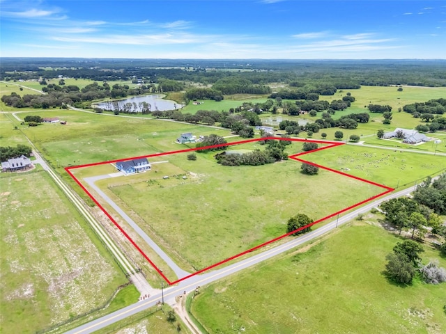 2437 Bay Lake Loop, Groveland, FL 34736 - aerial view of property and surrounding area with a large body of water and property parcel outlined