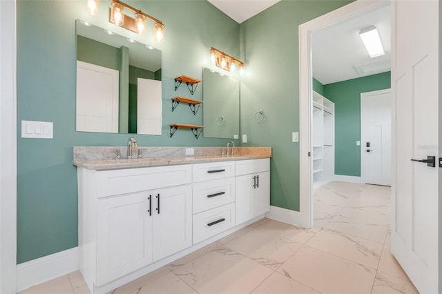 2437 Bay Lake Loop, Groveland, FL 34736 - bathroom with marble look tiles, double vanity, and a spacious closet