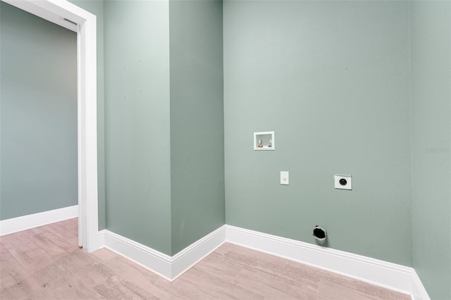 2437 Bay Lake Loop, Groveland, FL 34736 - washroom featuring hookup for an electric dryer, washer hookup, and wood finished floors