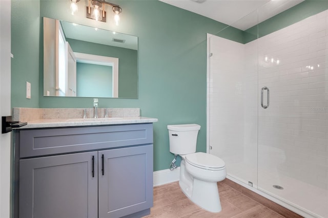 2437 Bay Lake Loop, Groveland, FL 34736 - bathroom featuring a shower stall, vanity, and wood finished floors