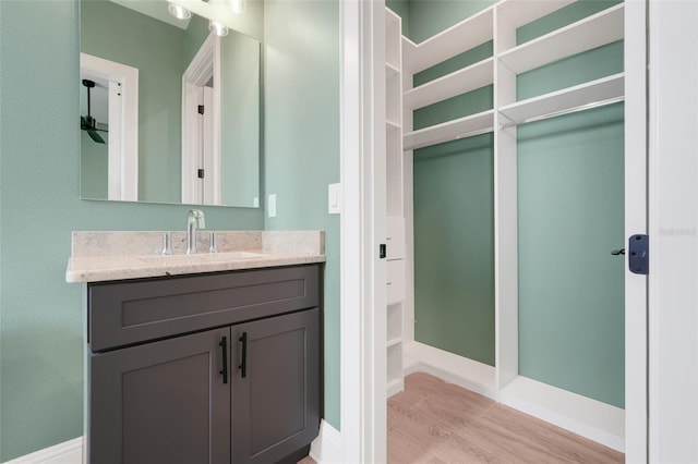 2437 Bay Lake Loop, Groveland, FL 34736 - bathroom with vanity and wood finished floors