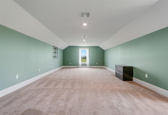 2437 Bay Lake Loop, Groveland, FL 34736 - additional living space with light carpet and vaulted ceiling