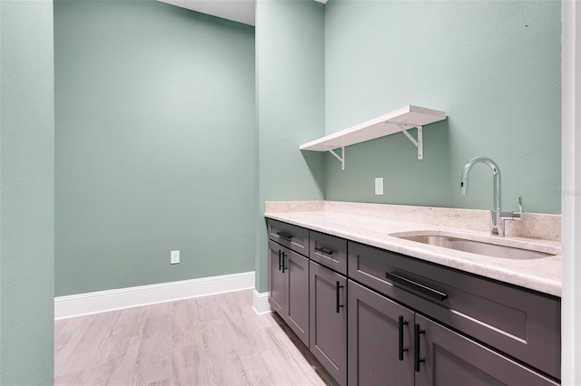 2437 Bay Lake Loop, Groveland, FL 34736 - washroom with a sink and light wood-style floors