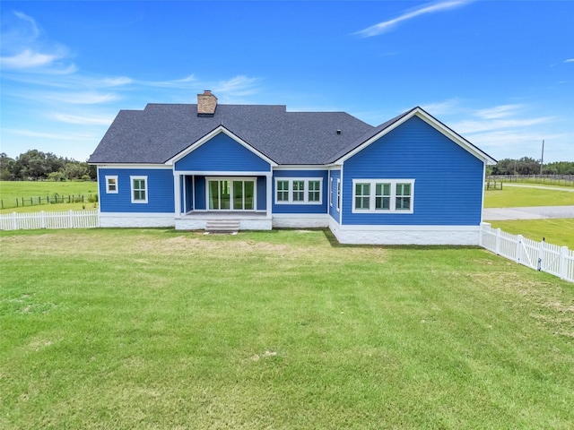 2437 Bay Lake Loop, Groveland, FL 34736 - back of property with a chimney and a shingled roof