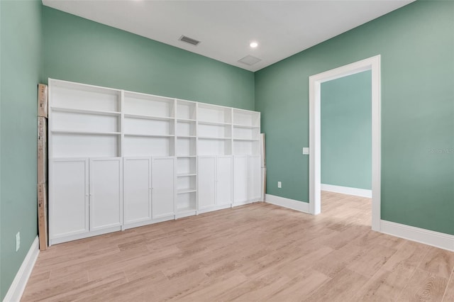 2437 Bay Lake Loop, Groveland, FL 34736 - unfurnished bedroom with light wood-type flooring and recessed lighting