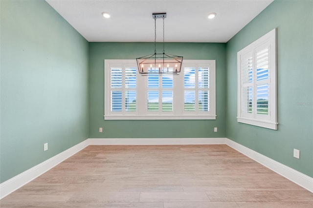 2437 Bay Lake Loop, Groveland, FL 34736 - unfurnished room with a chandelier, light wood-style floors, and recessed lighting