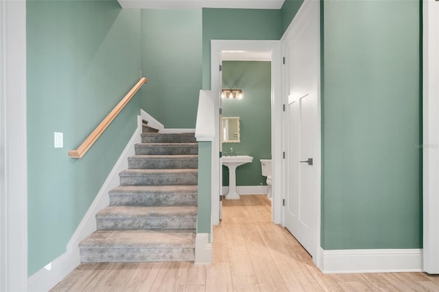 2437 Bay Lake Loop, Groveland, FL 34736 - staircase with wood finished floors and baseboards