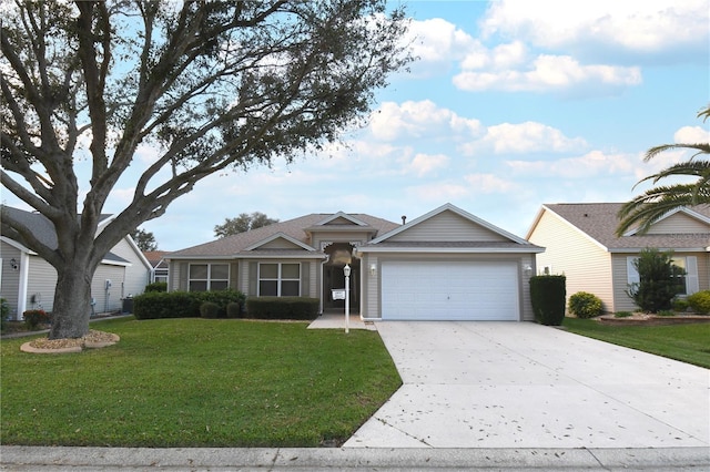 ranch-style house featuring concrete driveway, an attached garage, and a front yard