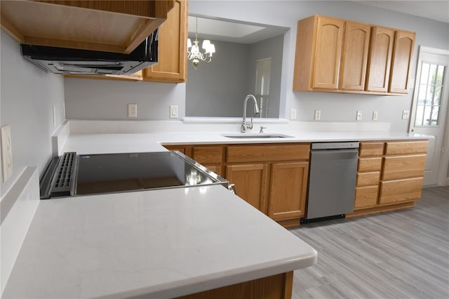 kitchen featuring light brown cabinetry, sink, hanging light fixtures, stainless steel dishwasher, and light hardwood / wood-style flooring