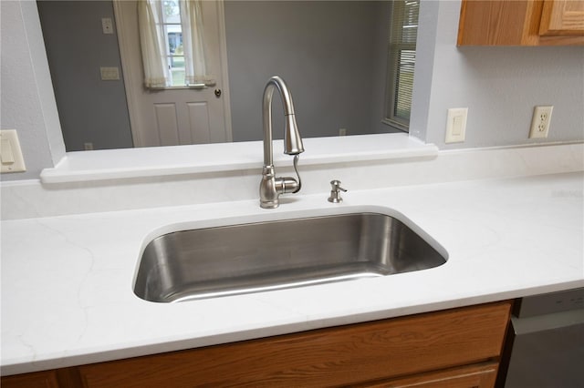 details with black dishwasher and sink