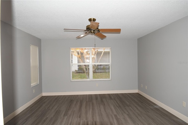 unfurnished room featuring ceiling fan, dark hardwood / wood-style floors, and a textured ceiling