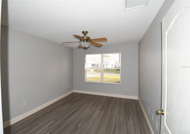 unfurnished room with dark wood-type flooring, ceiling fan, and a textured ceiling