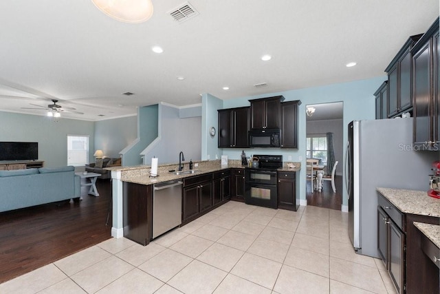 kitchen featuring black appliances, ceiling fan, ornamental molding, light hardwood / wood-style floors, and kitchen peninsula