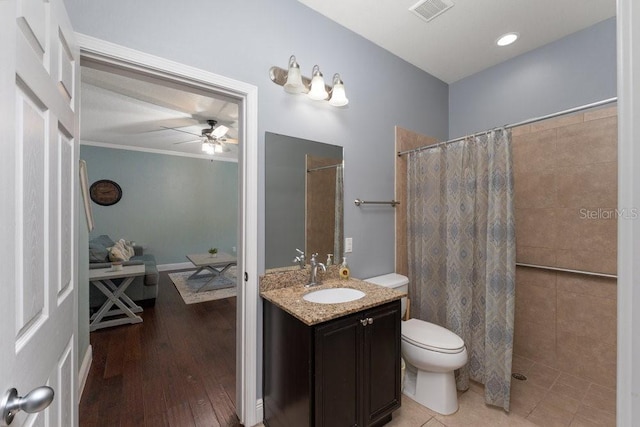 bathroom featuring hardwood / wood-style floors, vanity, toilet, and walk in shower