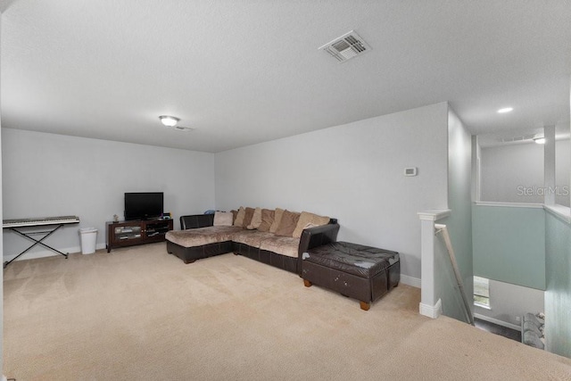 living room with carpet and a textured ceiling