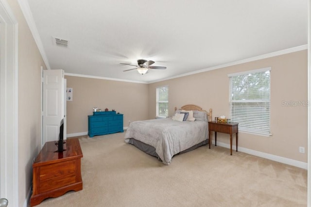 bedroom featuring light colored carpet, ceiling fan, and crown molding