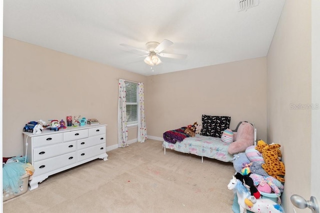 carpeted bedroom with ceiling fan