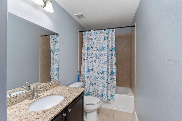 full bathroom with vanity, tile patterned flooring, toilet, a textured ceiling, and shower / tub combo