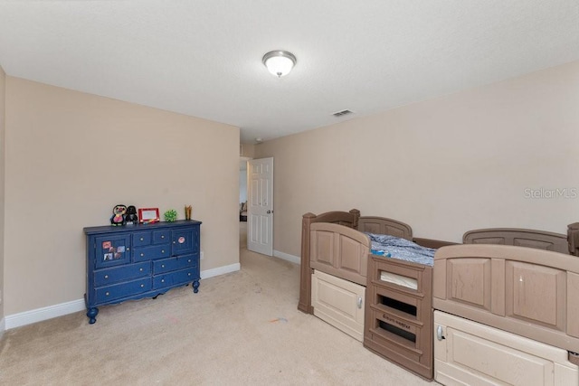 bedroom with light colored carpet