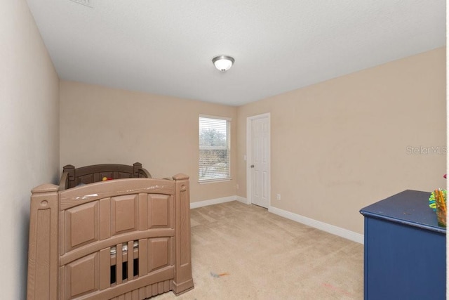 bedroom featuring light colored carpet