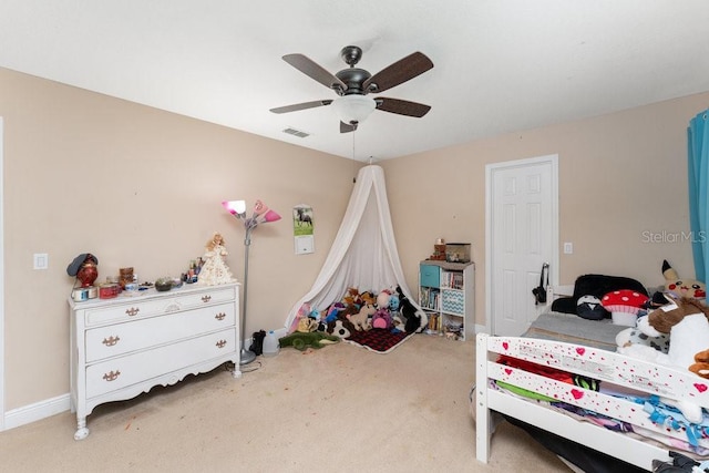 bedroom featuring ceiling fan and light colored carpet