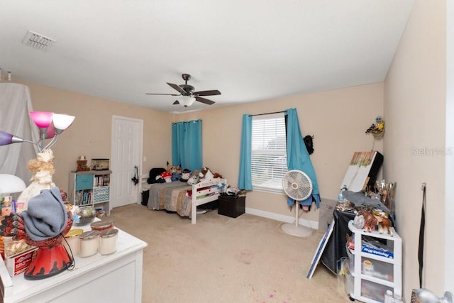 bedroom featuring ceiling fan and light colored carpet