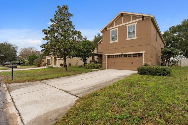 view of property with a garage and a front yard