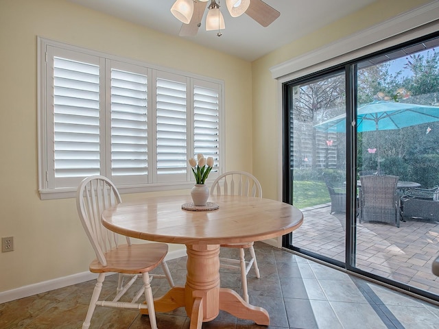 102 Cedar Way, Yalaha, FL 34797 - tiled dining space featuring ceiling fan and baseboards