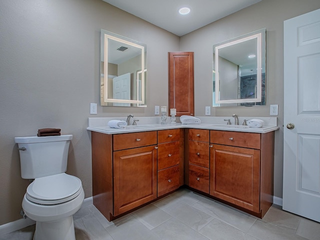 bathroom with tile patterned floors, vanity, and toilet