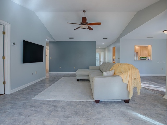 living room with ceiling fan and vaulted ceiling