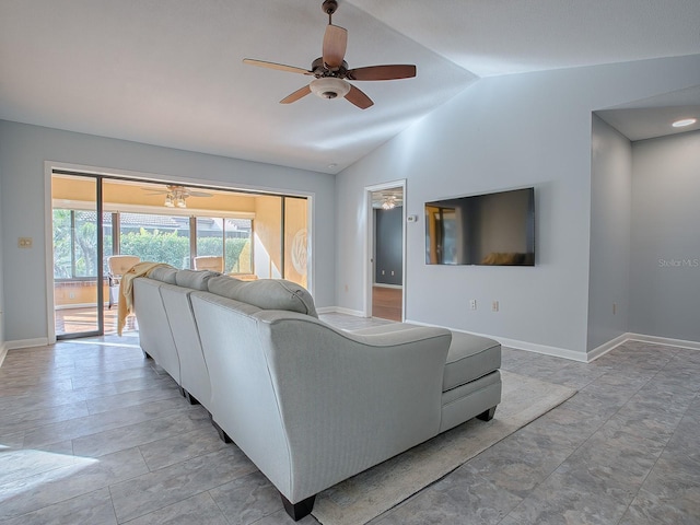 living room featuring ceiling fan and vaulted ceiling