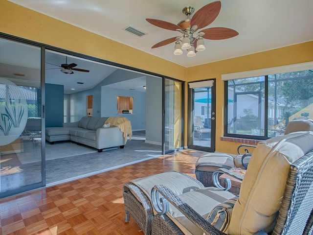 interior space featuring ceiling fan and lofted ceiling