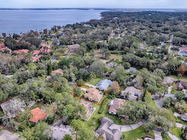 birds eye view of property with a water view