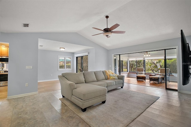102 Cedar Way, Yalaha, FL 34797 - living area featuring ceiling fan, healthy amount of natural light, and vaulted ceiling