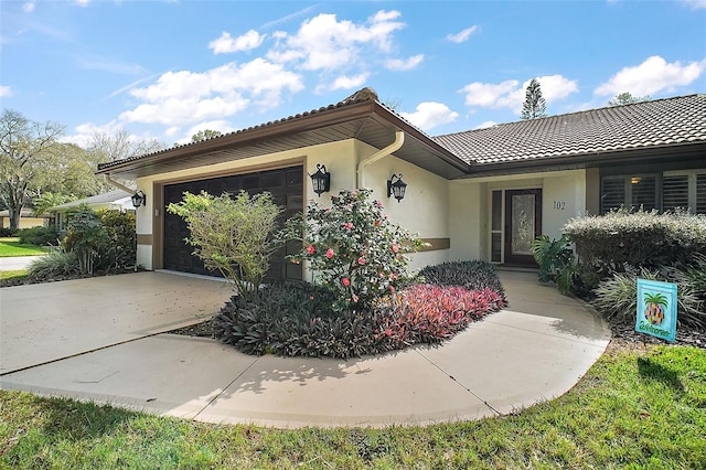 view of front of home with a garage