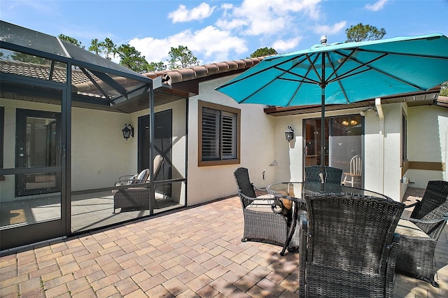 102 Cedar Way, Yalaha, FL 34797 - view of patio / terrace featuring a lanai and outdoor dining space