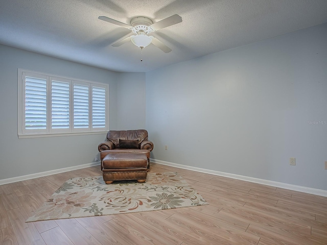 102 Cedar Way, Yalaha, FL 34797 - unfurnished room with a ceiling fan, wood finished floors, and a textured ceiling