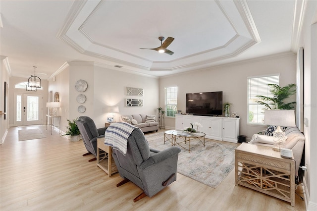 living room with light hardwood / wood-style flooring and a healthy amount of sunlight