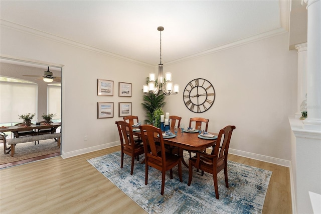 dining room with ceiling fan with notable chandelier, light wood-type flooring, and ornamental molding