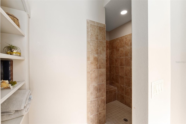 bathroom with tiled shower