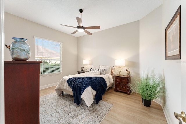 bedroom featuring ceiling fan and light hardwood / wood-style floors