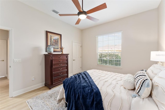 bedroom featuring light hardwood / wood-style flooring and ceiling fan