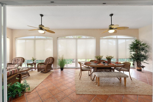 sunroom / solarium with ceiling fan