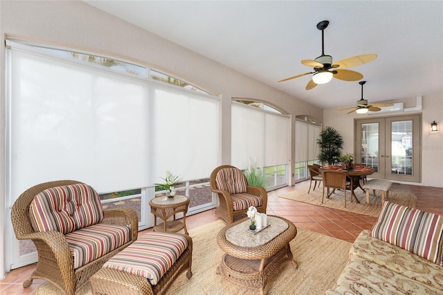 sunroom featuring ceiling fan and french doors