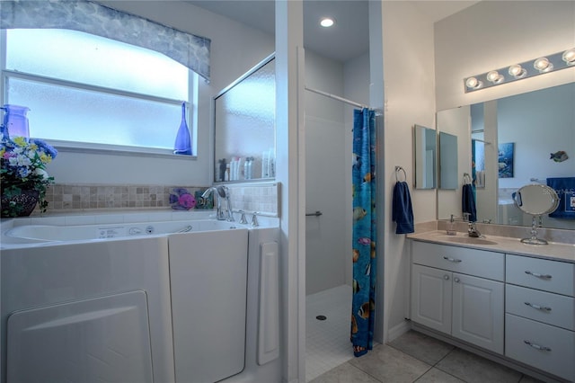 bathroom with tile patterned flooring, vanity, and curtained shower